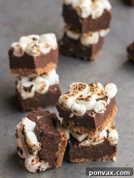 This S'mores Fudge only takes 15 minutes and six ingredients to prep - no baking required! This quick and easy fudge recipe is a no-mess way to enjoy s'mores.