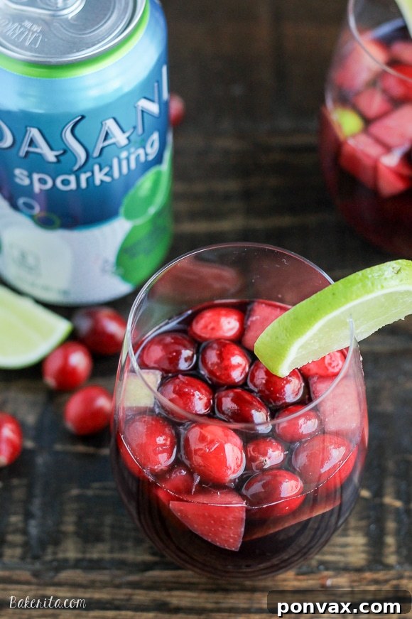 Tangy Cranberry Lime Sangria 2 Sparkling Cranberry Lime Sangria: The perfect festive, refreshing cocktail for a crowd during the holidays.