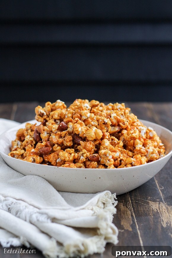 Crunchy Salted Honey Almond Caramel Corn, made without corn syrup, perfect for gifting or serving at gatherings.