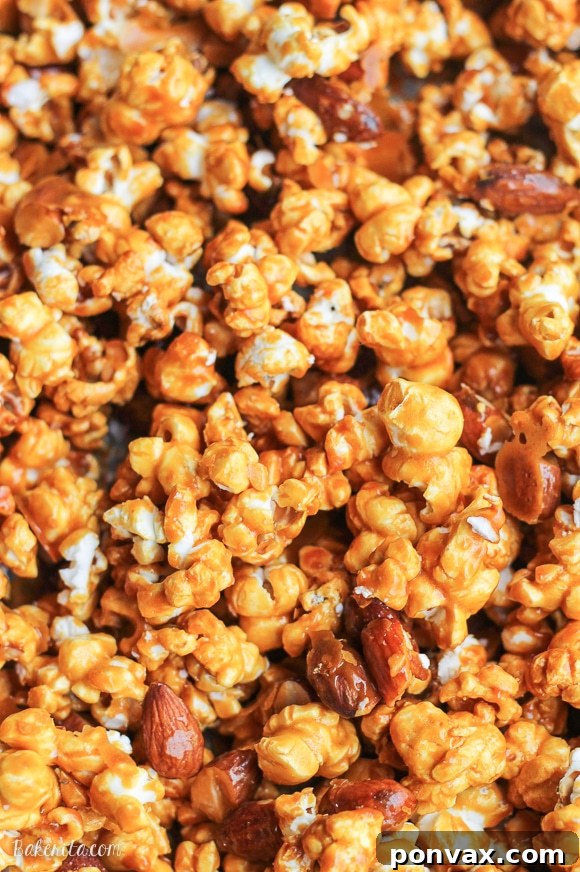 Close-up of golden Salted Honey Almond Caramel Corn, a healthy snack alternative.