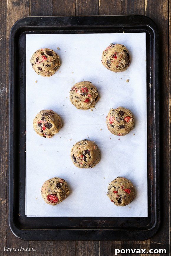 Strawberry Chocolate Indulgence Cookies 5 Another view of the chocolate-dipped strawberry chocolate chip cookies, highlighting the vibrant strawberry color.