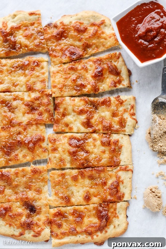 Whimsical Wands 5 Sweet Sticks dipped in marinara sauce, highlighting the savory and sweet flavors with a classic accompaniment.