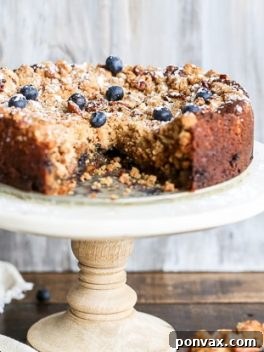 A delicious Blueberry Crumb Cake with a thick layer of pecan crumble, ready to be served.
