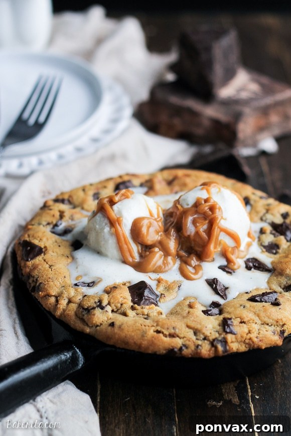 An overhead shot of the Peanut Butter Chocolate Chip Skillet Cookie, showing its thick, chewy texture, melted chocolate chips, and a golden-brown crust.