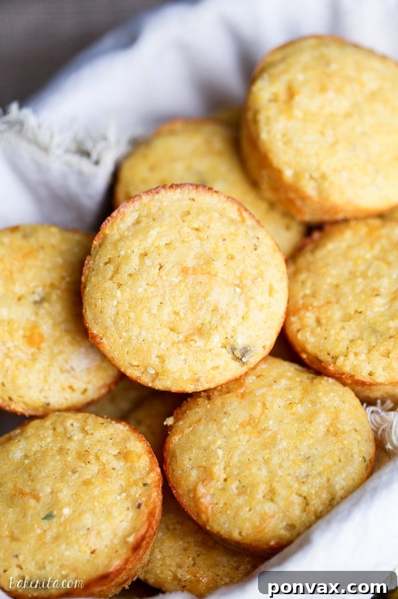 Deliciously golden Green Chile Corn Muffins, freshly baked and ready to be enjoyed as a side or snack.
