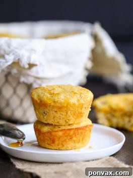 A tempting image of freshly baked Green Chile Corn Muffins, showcasing their golden crust and fluffy texture.