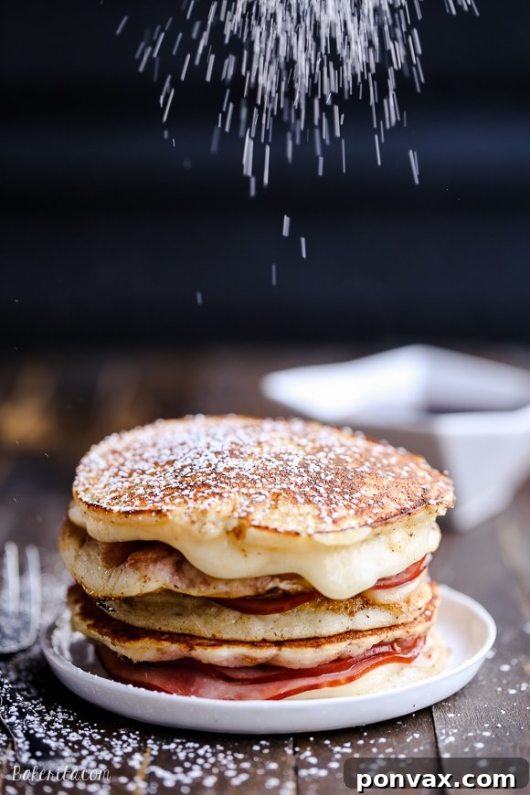A Monte Cristo Pancake being dipped in egg wash
