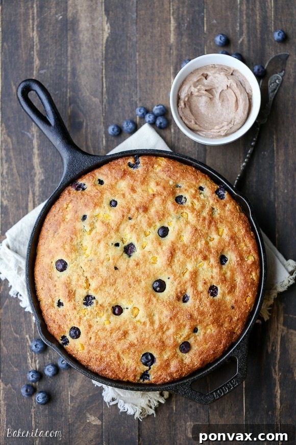 Blueberry Burst Skillet Cornbread 2 This Blueberry Cornbread is a sweeter take on traditional cornbread with fresh blueberries and sweet corn kernels. It's baked in a skillet and served with whipped cinnamon honey butter.