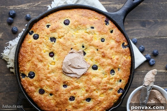 Blueberry Burst Skillet Cornbread 3 This Blueberry Cornbread is a sweeter take on traditional cornbread with fresh blueberries and sweet corn kernels. It's baked in a skillet and served with whipped cinnamon honey butter.