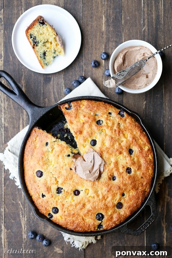 Blueberry Burst Skillet Cornbread 4 This Blueberry Cornbread is a sweeter take on traditional cornbread with fresh blueberries and sweet corn kernels. It's baked in a skillet and served with whipped cinnamon honey butter.