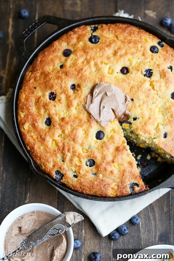 Blueberry Burst Skillet Cornbread 6 This Blueberry Cornbread is a sweeter take on traditional cornbread with fresh blueberries and sweet corn kernels. It's baked in a skillet and served with whipped cinnamon honey butter.