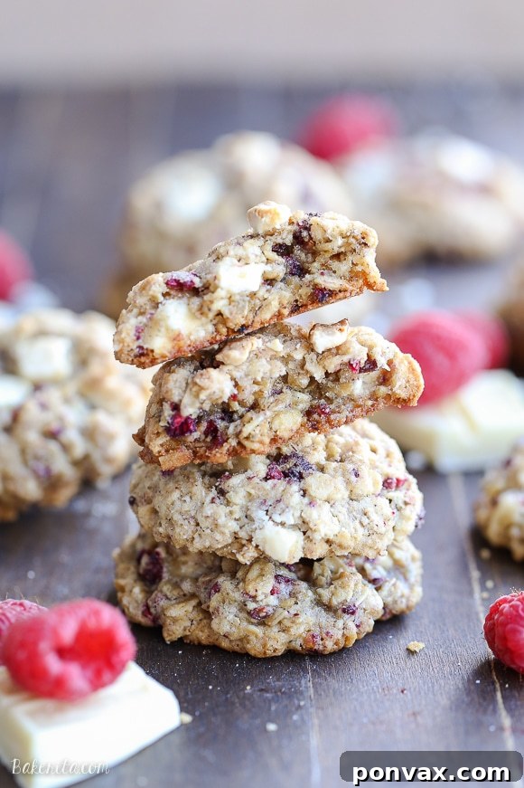 White Chocolate Raspberry Oat Delights 2 Thick and chewy Raspberry White Chocolate Oatmeal Cookies with crisp edges and large chunks of white chocolate and freeze-dried raspberries.