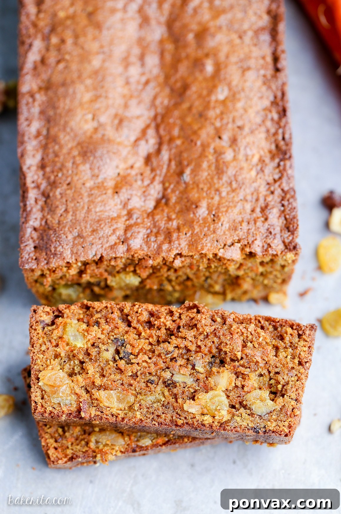 Indulge in this incredibly moist and flavorful Paleo Carrot Bread, packed with warming spices, crunchy walnuts, and sweet golden raisins. A perfectly wholesome, gluten-free, and refined sugar-free quick bread for any time of day.