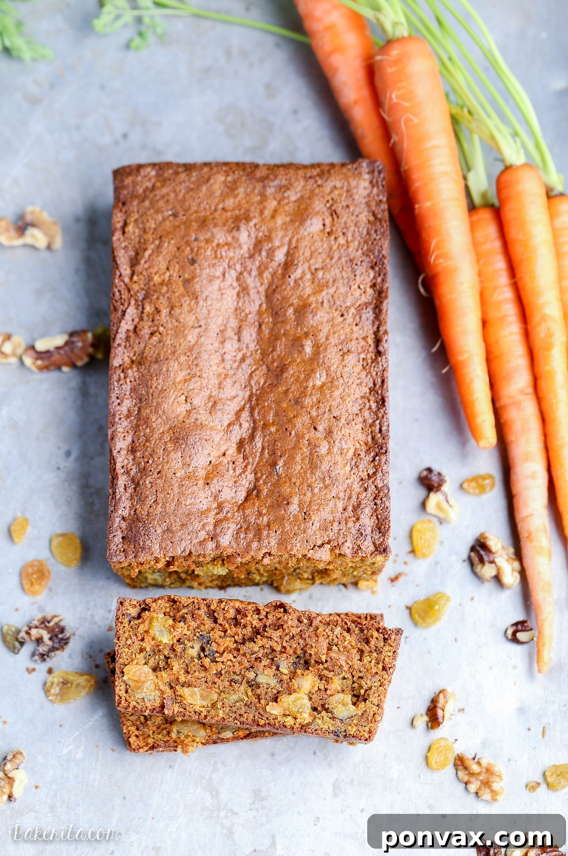 A vibrant, close-up shot of grated carrots, walnuts, and golden raisins, the key ingredients that make this Paleo Carrot Bread so flavorful and nutritious. Perfect for a healthy quick bread recipe.