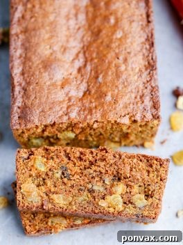 This Paleo Carrot Bread is incredibly moist, and full of spices, chopped walnuts and golden raisins. This hearty bread is gluten-free and refined sugar free.
