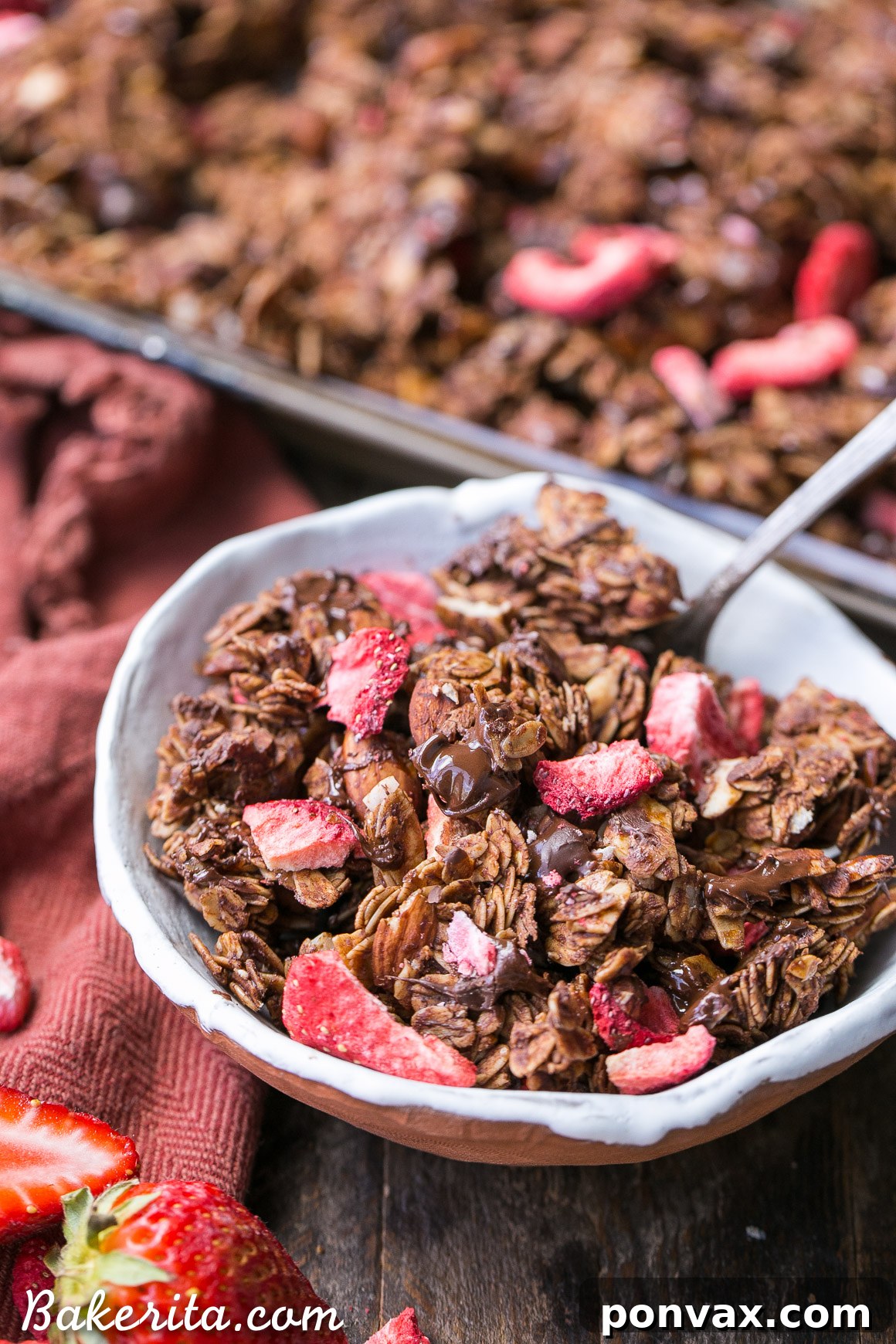 Homemade Chocolate Strawberry Granola served in a rustic bowl with a spoon