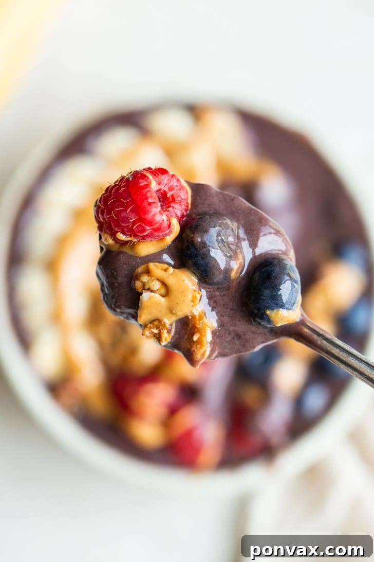 A perfectly blended acai bowl ready for toppings, showcasing its thick and creamy consistency.