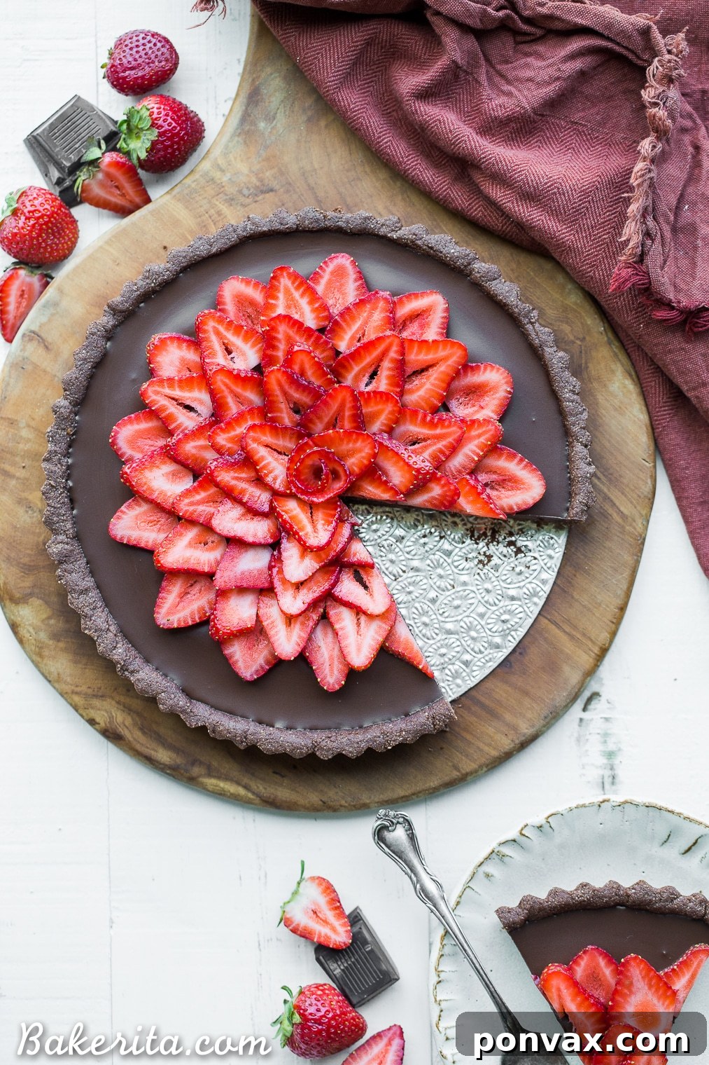 This Strawberry Chocolate Tart is filled with vegan chocolate ganache and topped with fresh strawberries, all in a chocolate crust. Slice into this easy and delicious gluten-free, Paleo, and vegan dessert.