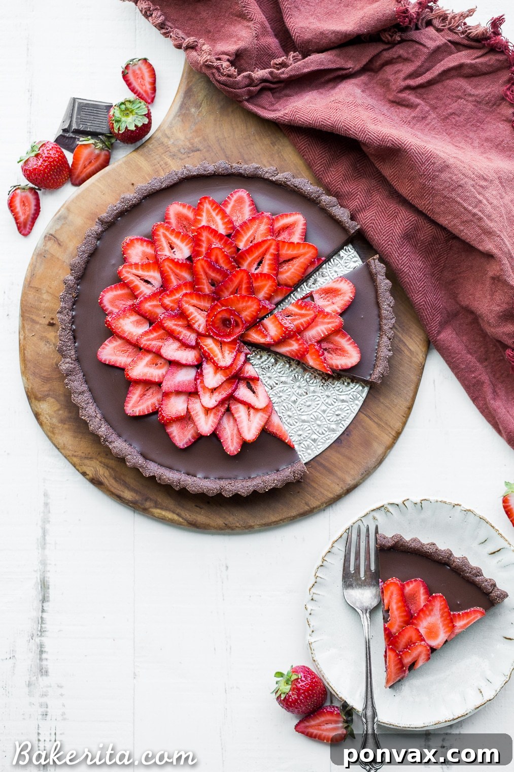 This Strawberry Chocolate Tart is filled with vegan chocolate ganache and topped with fresh strawberries, all in a chocolate crust. Slice into this easy and delicious gluten-free, Paleo, and vegan dessert.