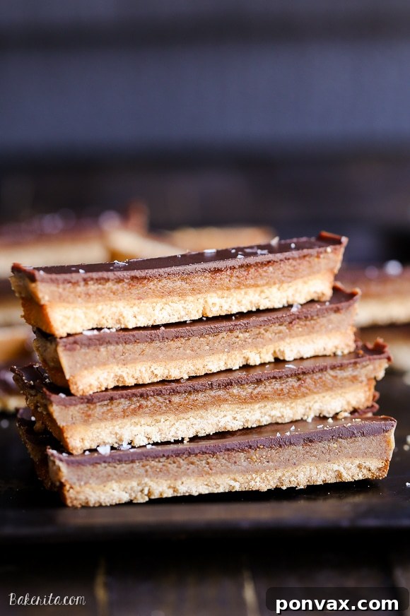 A close-up shot of the caramel layer being poured over the baked shortbread crust in a pan.