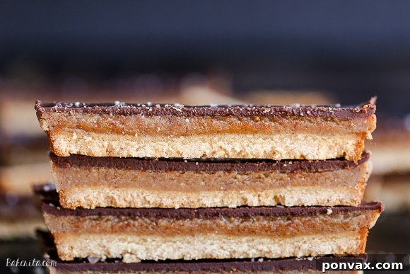 Close-up of the gooey caramel layer covering the shortbread crust in a baking pan.