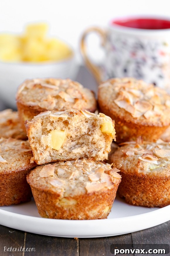 Have a taste of the tropics with these Vegan Pineapple Coconut Muffins! They're super soft, full of tropical flavor, and no one would ever guess that they are dairy-free + vegan.