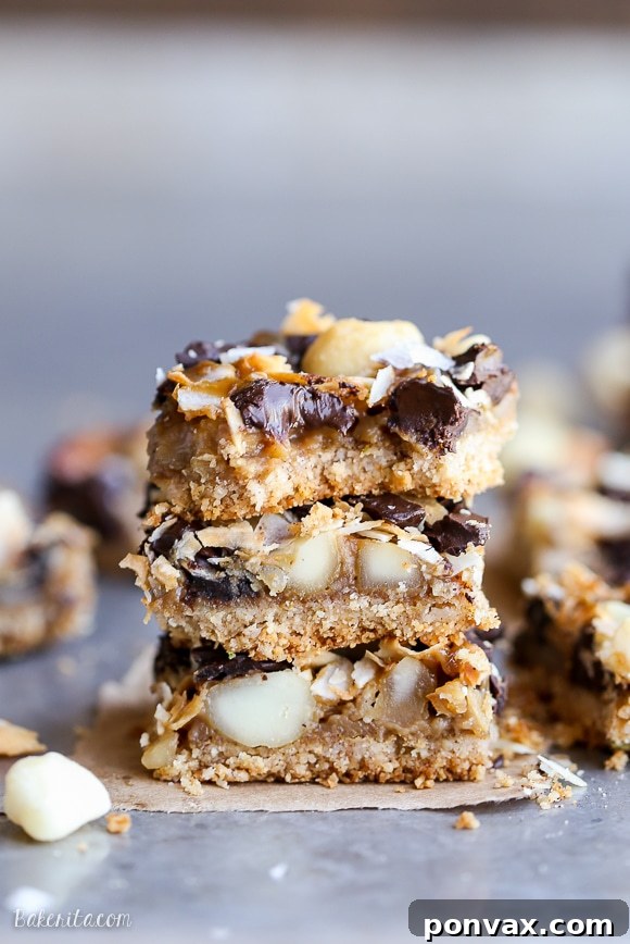 Decadent Dark Chocolate Macadamia Nut Bars Gluten Free Vegan 2 Gooey Dark Chocolate Macadamia Nut Magic Bars with a hint of tropical flair, vegan caramel, and a gluten-free coconut lime crust.