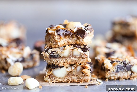 Decadent Dark Chocolate Macadamia Nut Bars Gluten Free Vegan 5 Freshly baked Dark Chocolate Macadamia Nut Magic Bars cooling, showing their rich, inviting textures and golden caramel.