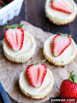 These Greek Yogurt Cheesecakes are smooth and creamy with a bit of tanginess and a crunchy granola crust. These gluten-free cheesecakes were delicious for breakfast topped with fresh berries, and they're only 177 calories each!