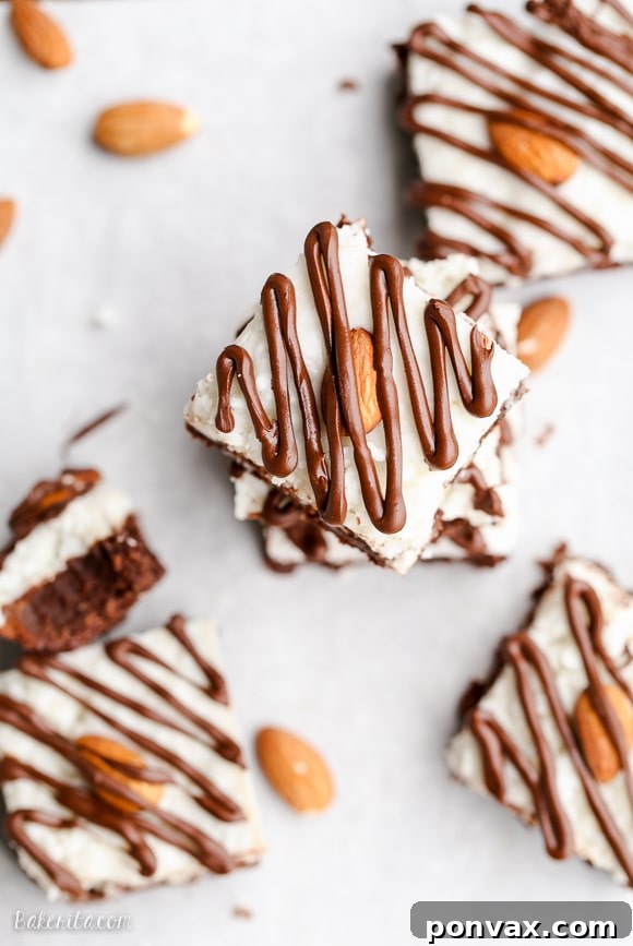 Making your own coconut butter for these Almond Joy Brownies is simple, requiring only shredded coconut and a blender, for a fresh and economical topping.