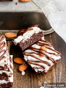 These Almond Joy Brownies have a coconut butter topping and a drizzle of dark chocolate - you'd never guess that these indulgent brownies are gluten-free, refined sugar-free, and Paleo!