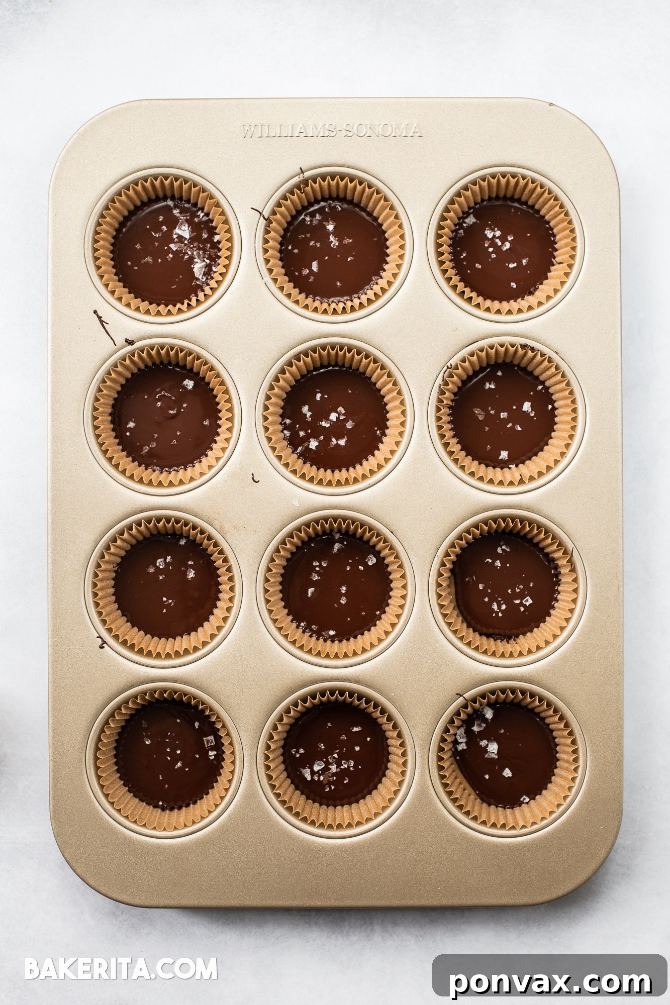A single Vegan Chocolate Peanut Butter Caramel Cup, perfectly formed and ready to be enjoyed.