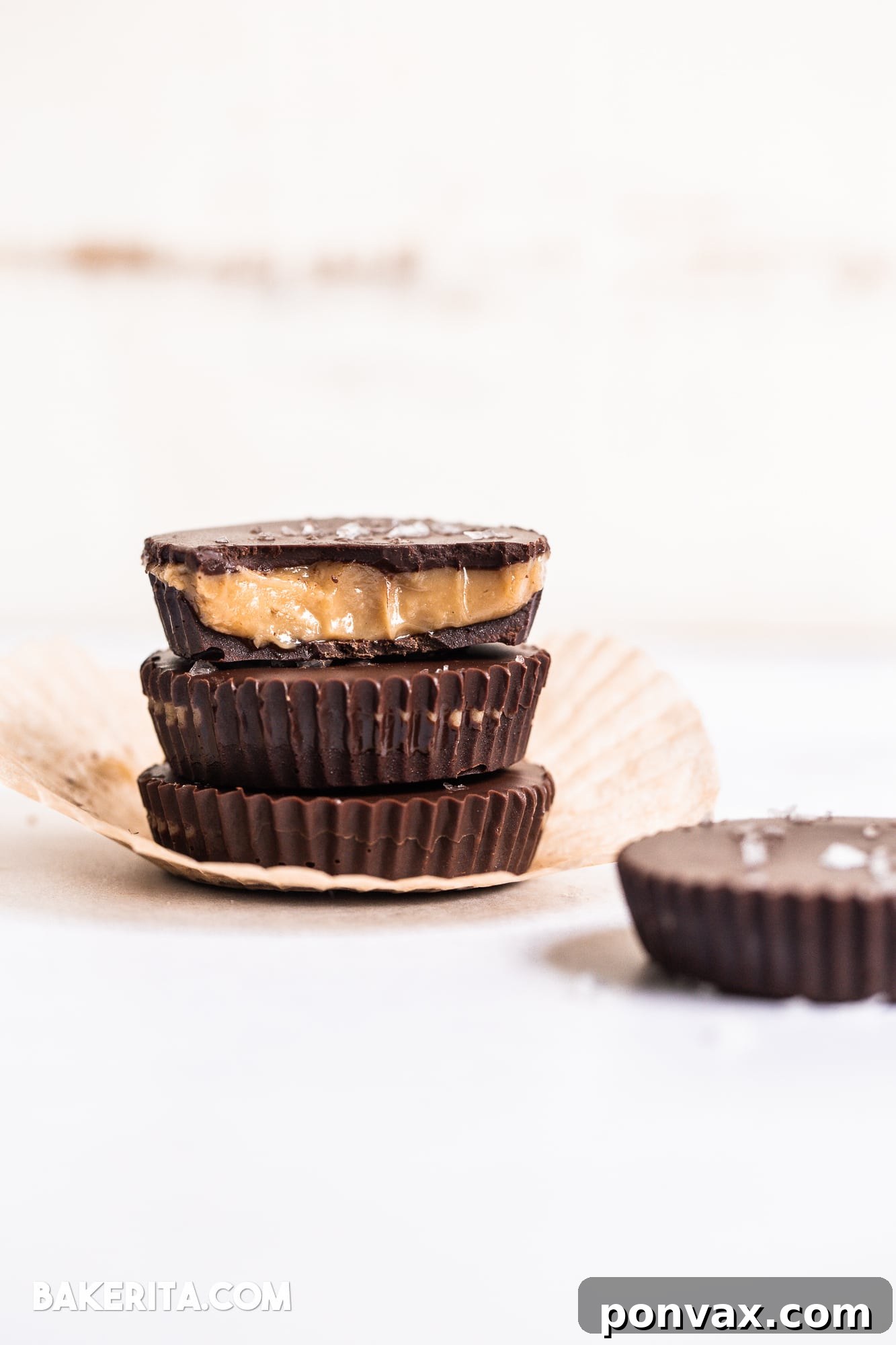 A plate of freshly made Vegan Chocolate Peanut Butter Caramel Cups, ready to be served.