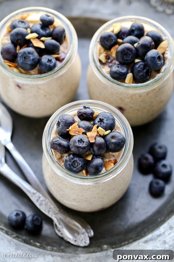 Blueberry Muffin Overnight Delight 6 A jar of Blueberry Muffin Overnight Oats with fresh blueberries on top, ready to eat.