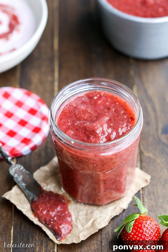 Vibrant Strawberry Rhubarb Chia Jam 6 Several jars of homemade Strawberry Rhubarb Chia Jam ready for storage, showcasing its rich texture and natural ingredients.
