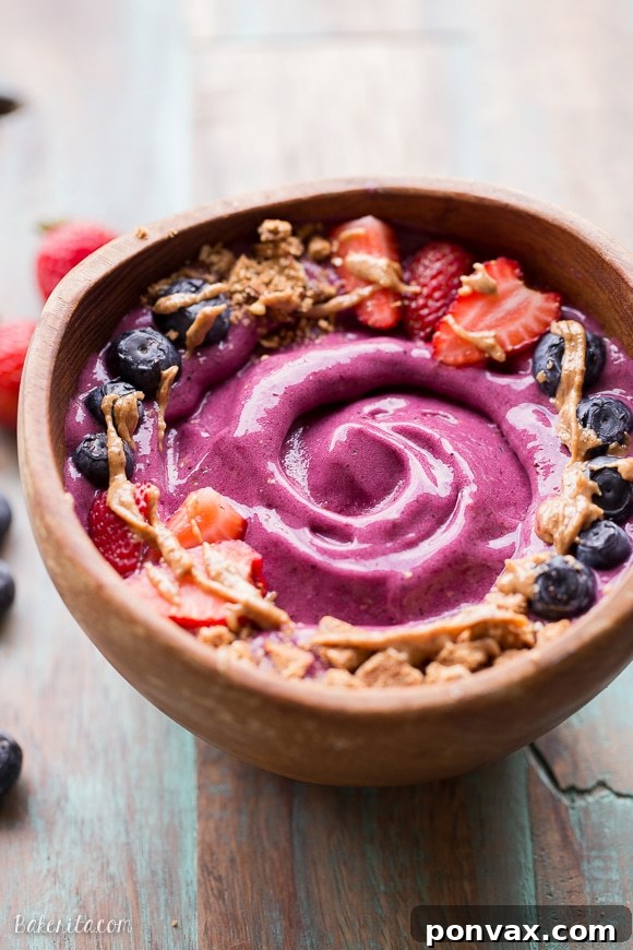 A Berry Pitaya Smoothie Bowl, beautifully garnished and ready to be enjoyed as a healthy breakfast.