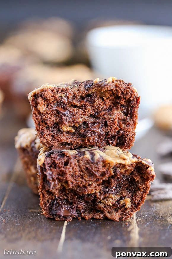Close-up of a freshly baked Chocolate Peanut Butter Banana Muffin, showcasing its soft texture and inviting aroma.