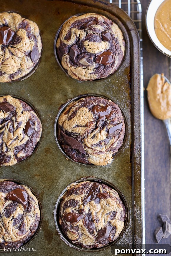 Close-up of a single Chocolate Peanut Butter Banana Muffin, showing the texture and delicious swirl.