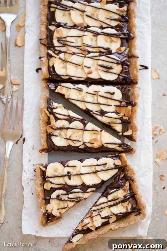This No-Bake Chocolate Banana Tart has an easy date crust, filled with creamy chocolate ganache and sliced bananas! This quick and simple recipe is only has five ingredients and it's gluten-free, Paleo and vegan.