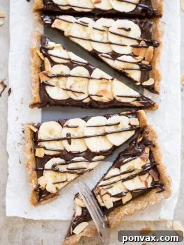 This No-Bake Chocolate Banana Tart has an easy date crust, filled with creamy chocolate ganache and sliced bananas! This quick and simple recipe is only has five ingredients and it's gluten-free, Paleo and vegan.