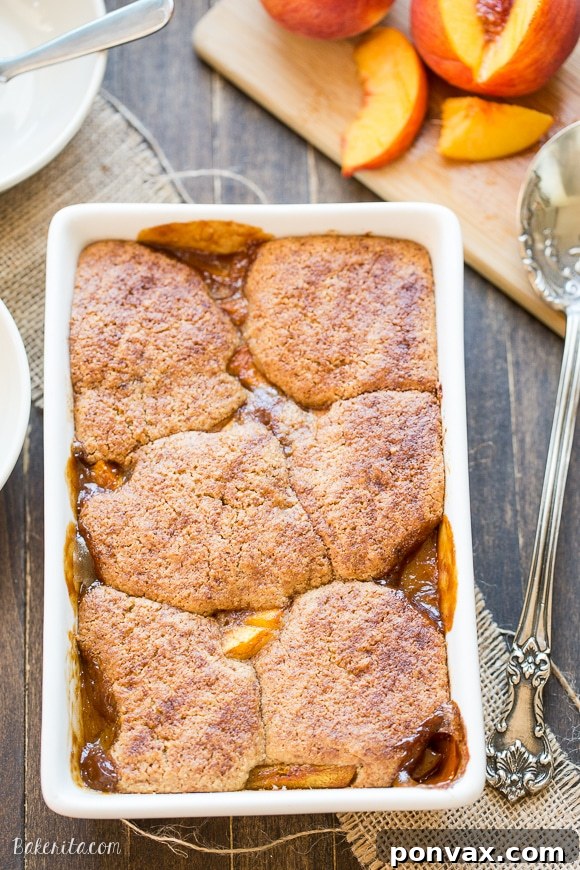 This Peach Cobbler has a crispy, fluffy topping with a simple peach filling - it's the most perfect summer dessert! This is a gluten-free, Paleo, and vegan treat that you don't want to miss.