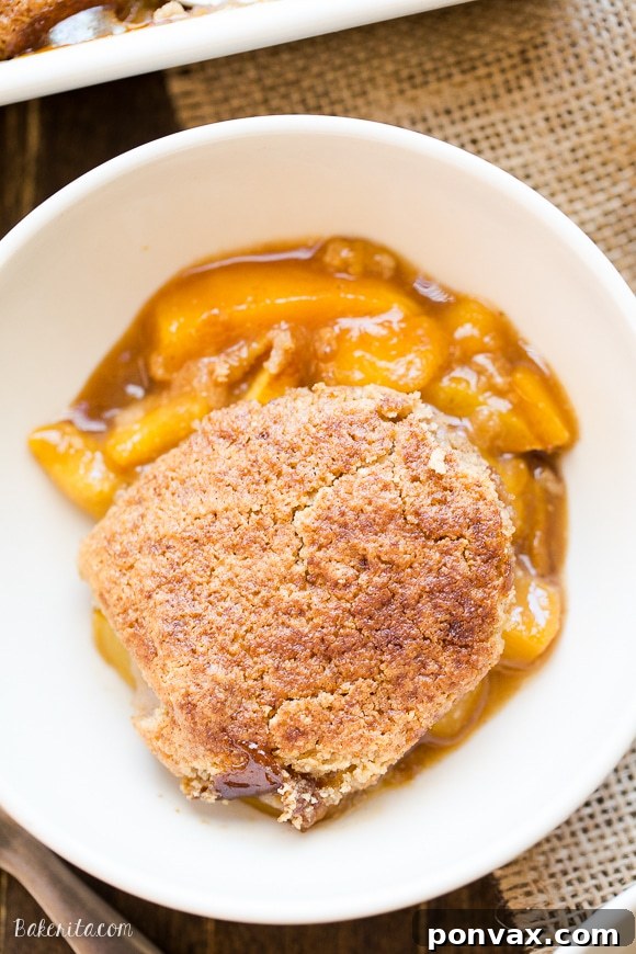This Peach Cobbler has a crispy, fluffy topping with a simple peach filling - it's the most perfect summer dessert! This is a gluten-free, Paleo, and vegan treat that you don't want to miss.