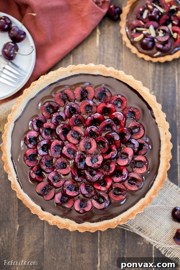 Clean Eating Chocolate Cherry Tart with Almond Crust 3 This Chocolate Cherry Tart has a toasted almond shortbread crust filled with silky chocolate ganache and fresh cherries! This gluten-free, Paleo, and vegan dessert is incredibly rich and comes together quickly.