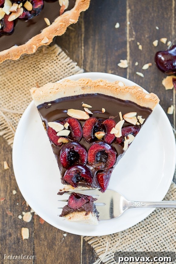 Clean Eating Chocolate Cherry Tart with Almond Crust 4 This Chocolate Cherry Tart has a toasted almond shortbread crust filled with silky chocolate ganache and fresh cherries! This gluten-free, Paleo, and vegan dessert is incredibly rich and comes together quickly.