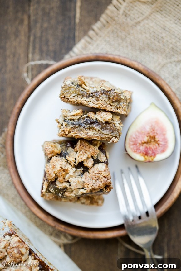Soft-Baked Gluten-Free Plant-Based Oat Fig Bars 4 Stack of Gluten-Free Oatmeal Fig Bars on a wooden surface