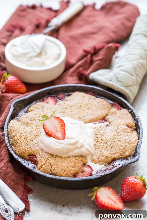 Allergy-Friendly Strawberry Cobbler Dream 6 Overhead shot of a small batch strawberry cobbler with coconut cream, ready to be enjoyed.