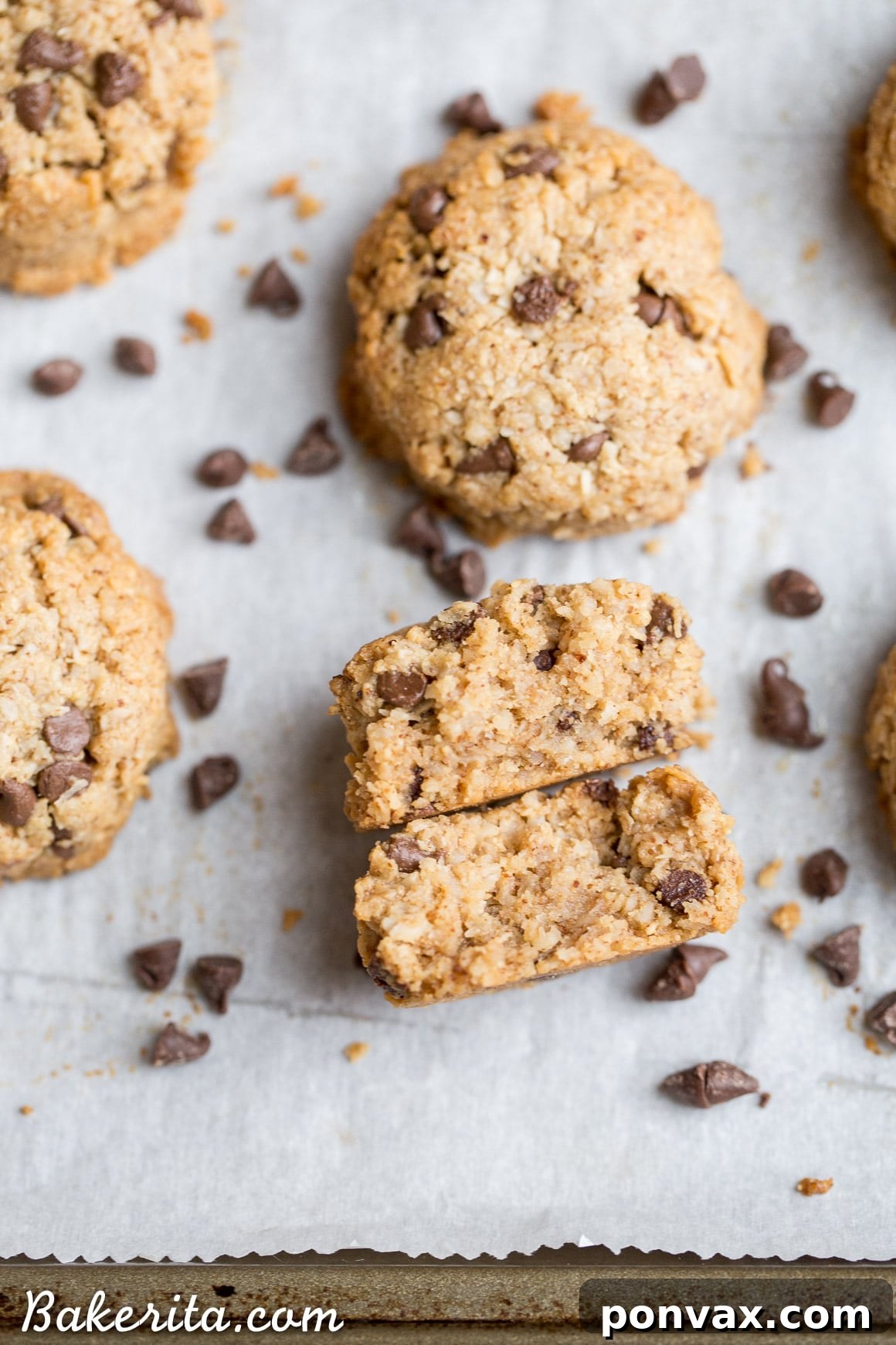 Hand reaching for a perfect chocolate chip macaroon from a serving platter