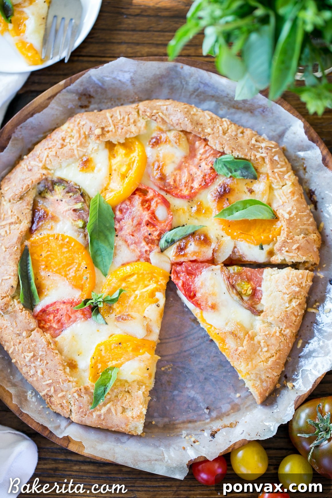 Rustic Gluten-Free Tomato Mozzarella Galette with a Golden Parmesan Crust 5 The Mozzarella Heirloom Tomato Galette, still warm, with golden edges and a bubbly cheese filling, ready to be sliced.