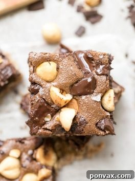 Beautifully presented Gluten-Free Chocolate Hazelnut Bars, showing the fudgy texture and delicious topping.