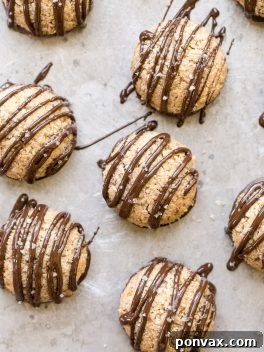 Chocolate Dipped Vanilla Bean Macaroons, a delectable vegan and paleo recipe from the Oh She Glows Everyday cookbook.